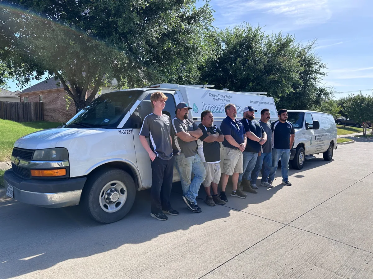 Jensen Plumbing team with service vehicles