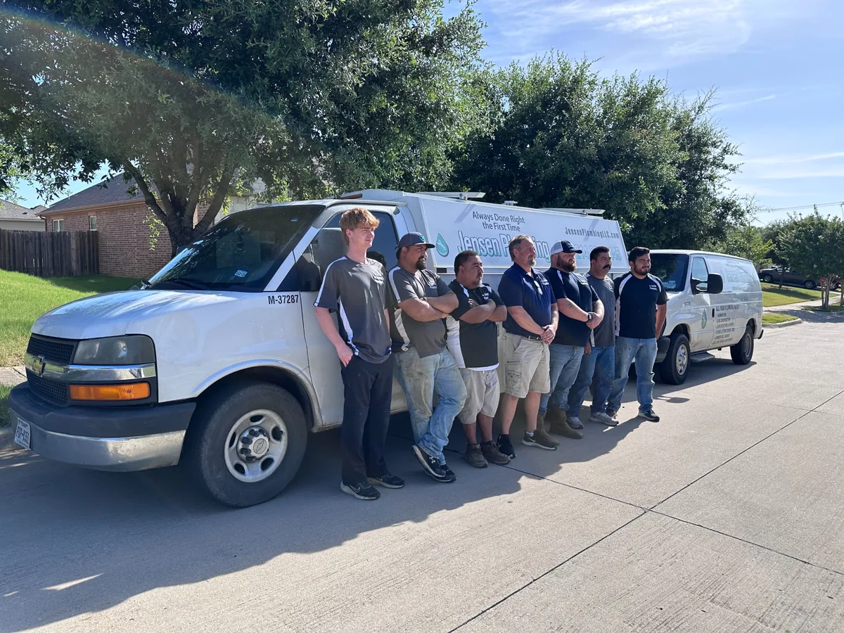 The Jensen Plumbing crew with their service trucks in Denton, Texas